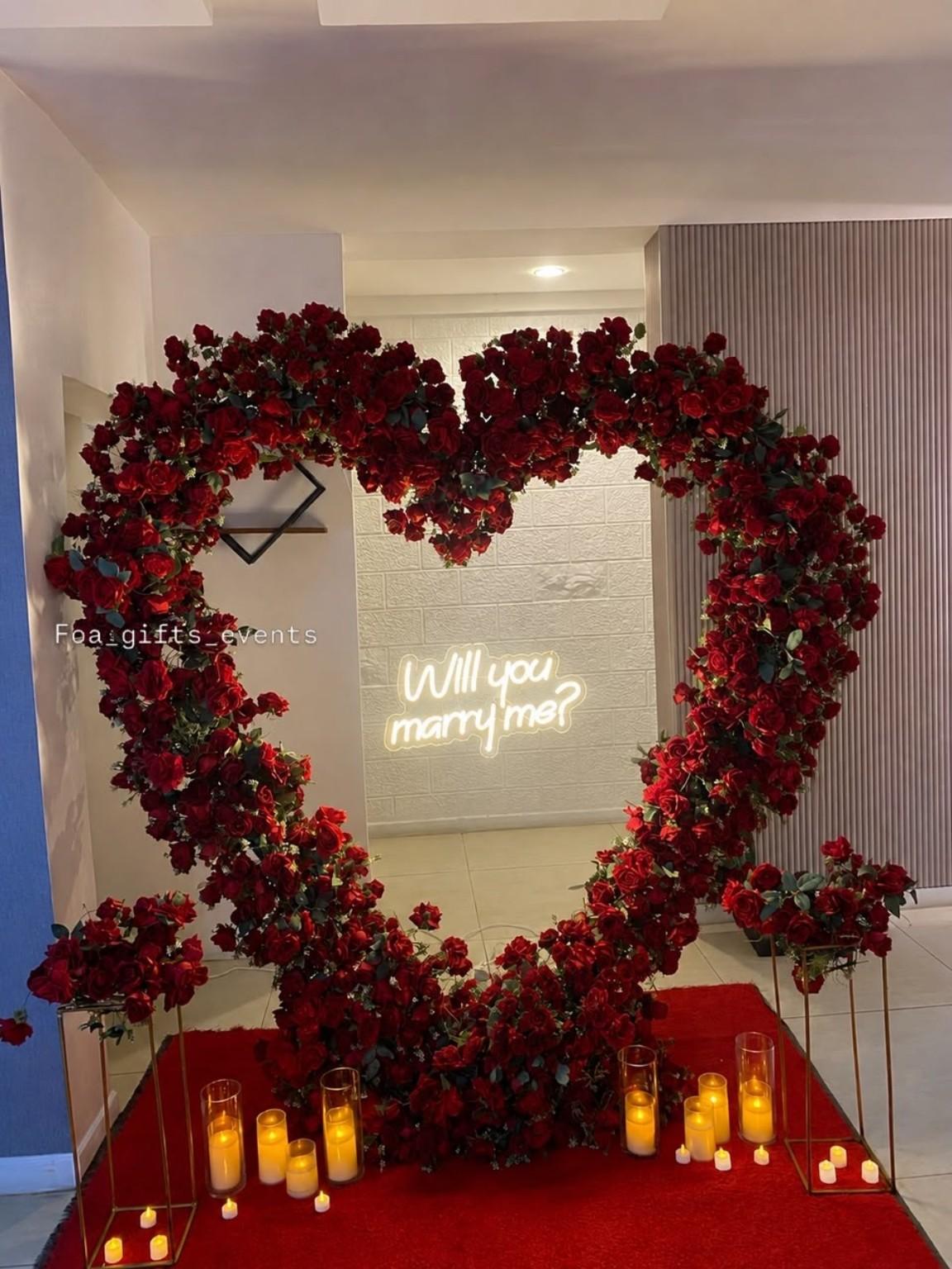 Red floral proposal heart with candle-style lighting