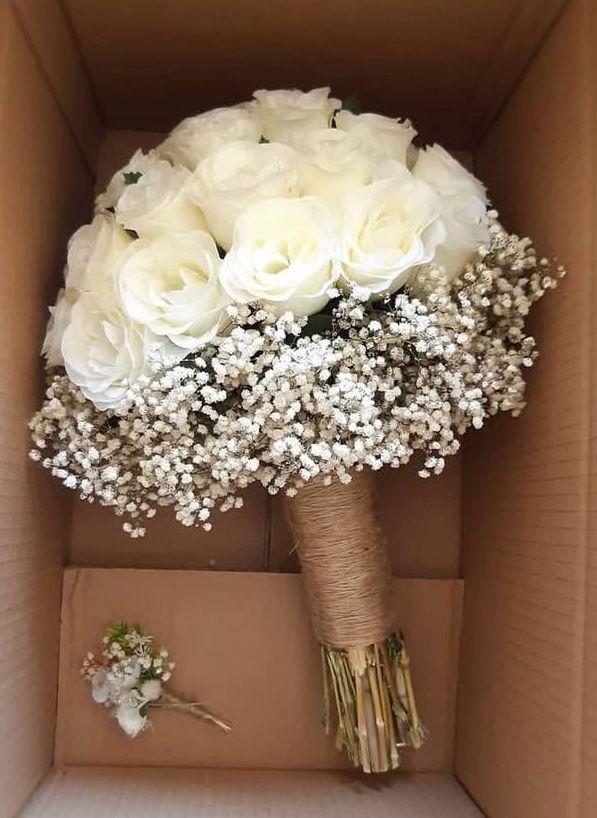 White roses and small white flowers as a neutral floral palette reference