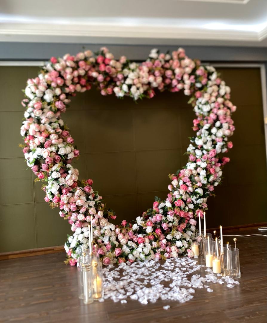 Grand pink and white floral heart arch proposal décor in Nigeria FOA_gifts