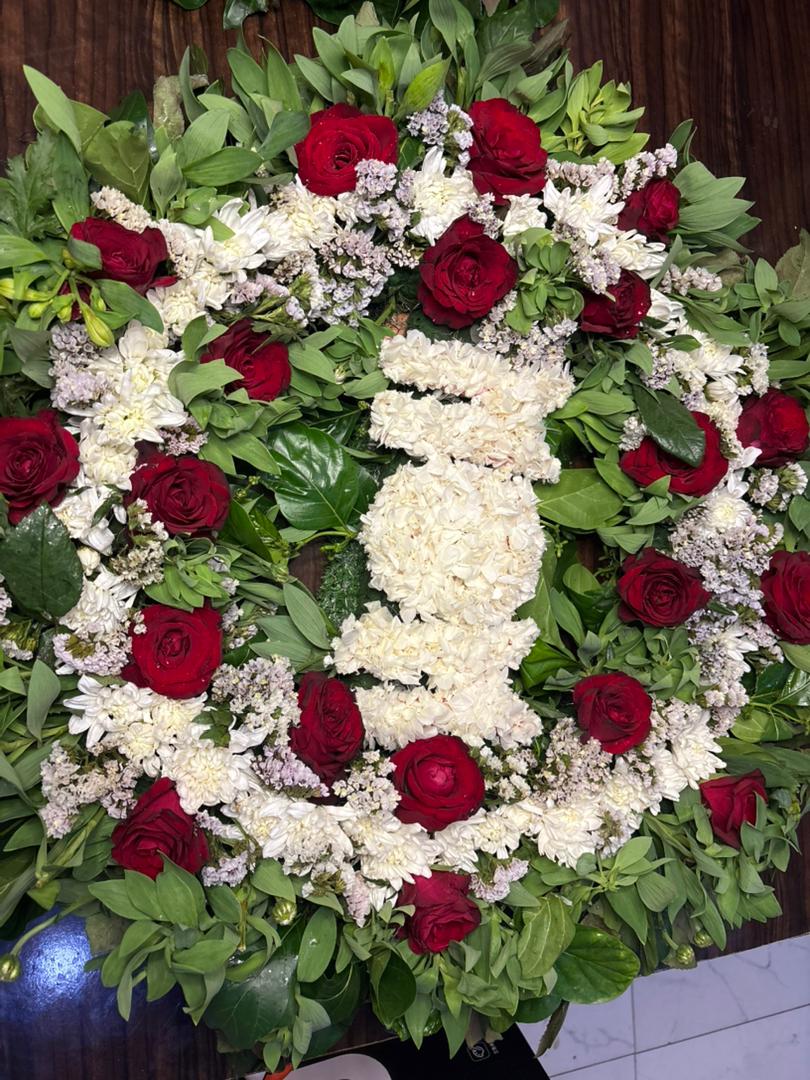Cross-shaped floral tribute wreath